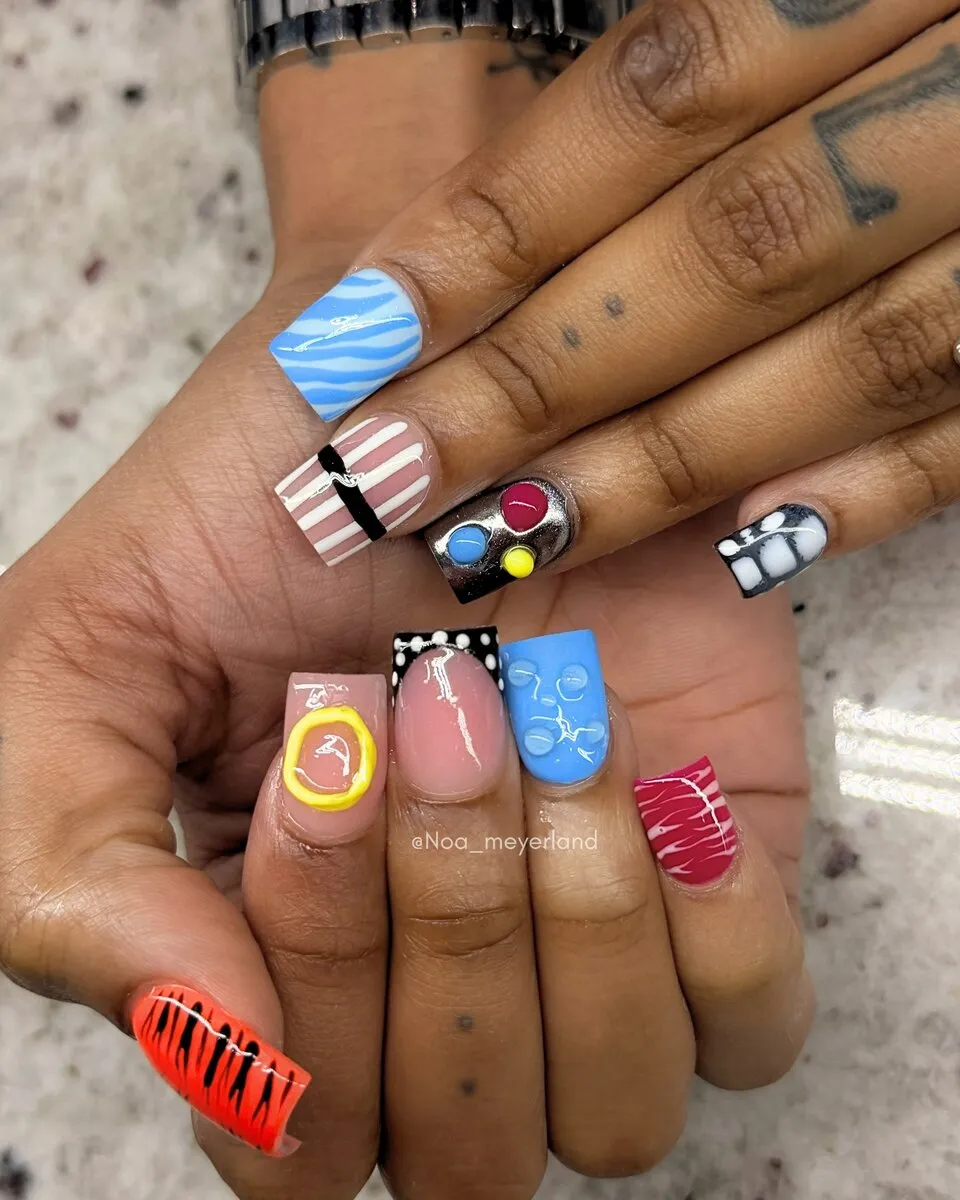 Sky-blue nails with hand-painted festive nail art
