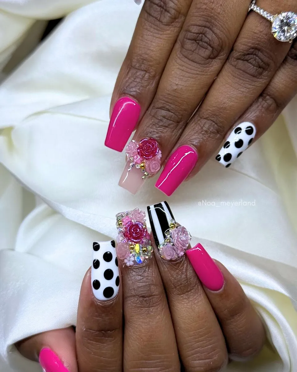 Bold hot-pink coffin nails with white polka-dot accent nails