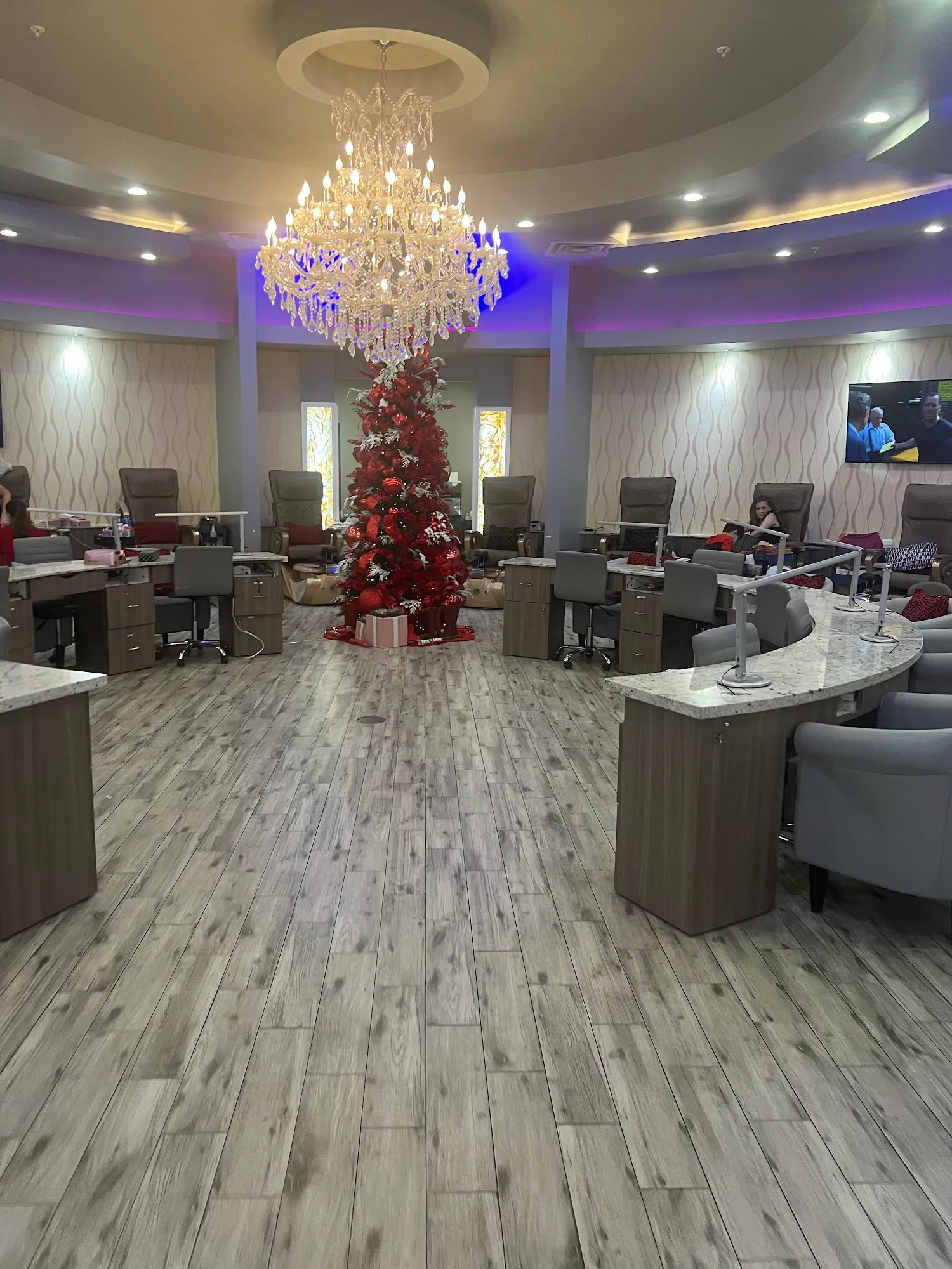 Crystal chandelier and elegant pedicure lounge inside Nails of America Meyerland