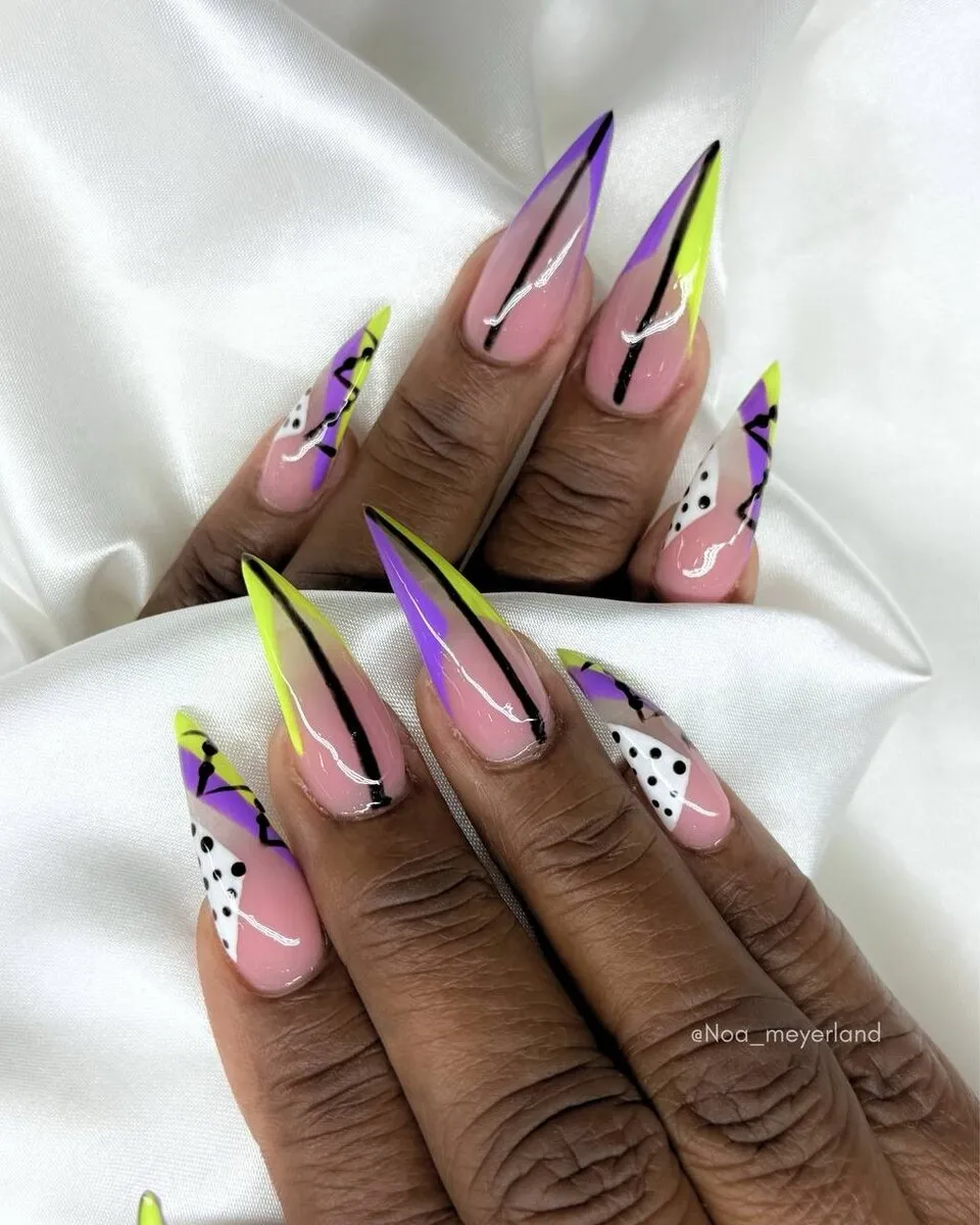Lavender stiletto nails with flowing abstract swirl nail art